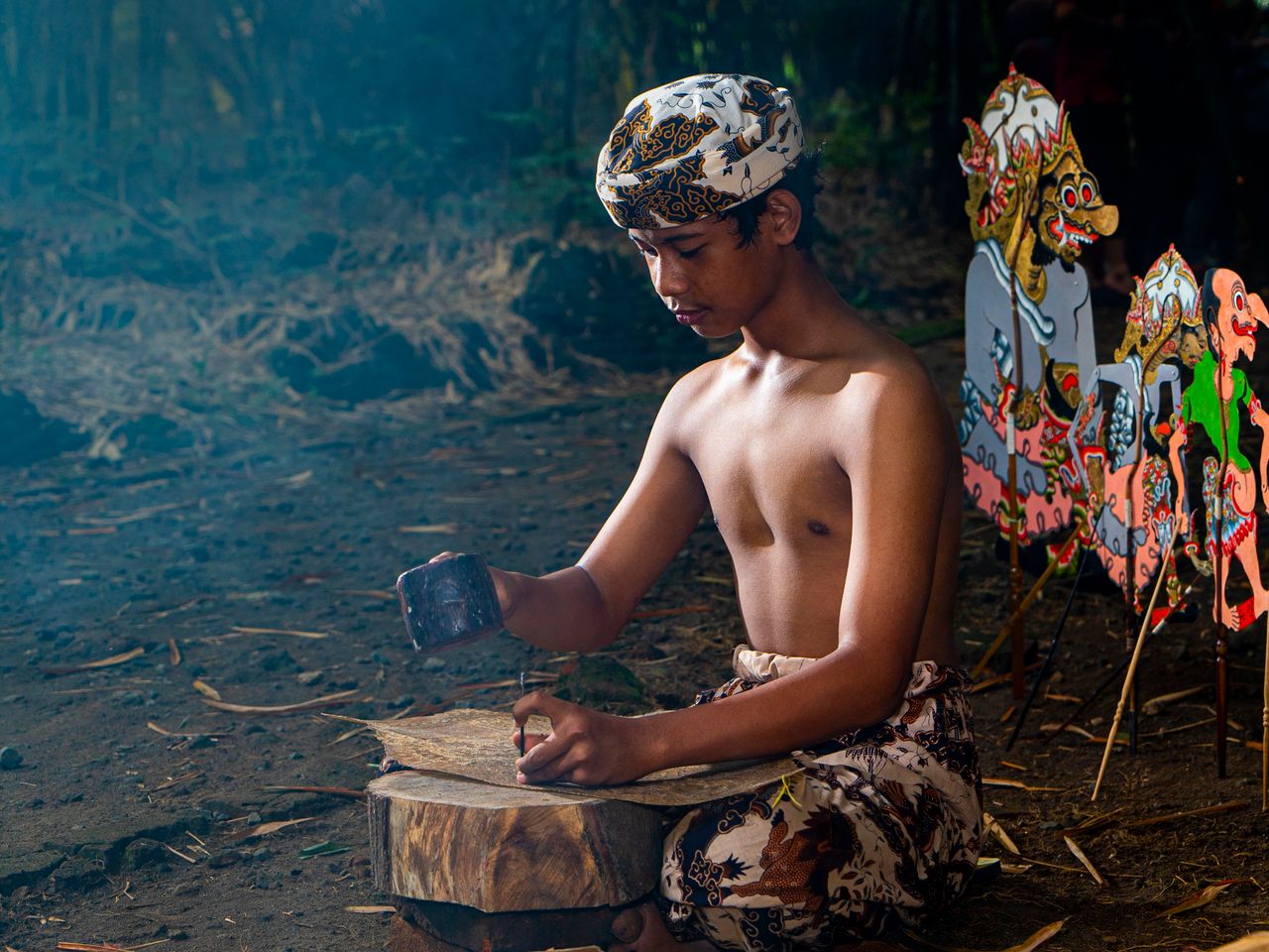 The Art of Drawing Readers In: Your attractive post title goes here Young artisan crafting Wayang Kulit puppets in Cirebon, Indonesia.